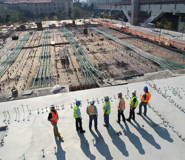 construction worker pouring concrete
